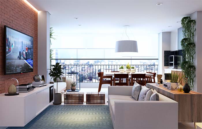 Varanda gourmet integrada a sala de estar aumenta a área social do apartamento.